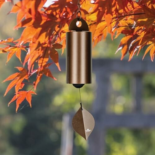 Bronze wind chime with autumn leaves.