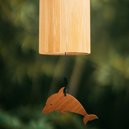 Bamboo wind chime with dolphin design hanging