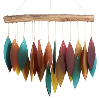 Colorful leaf-shaped wind chime hanging on wooden rod