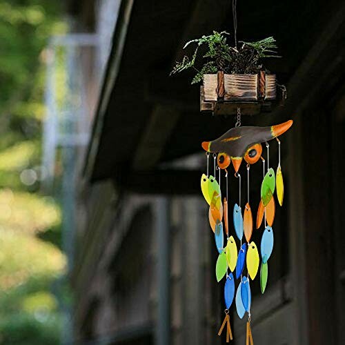 Owl wind chime with colorful hanging pieces outside