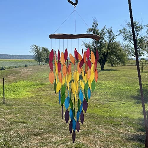 Colorful leaf-shaped wind chime hanging outdoors