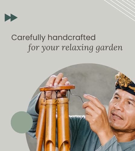 Person holding handcrafted wind chimes.