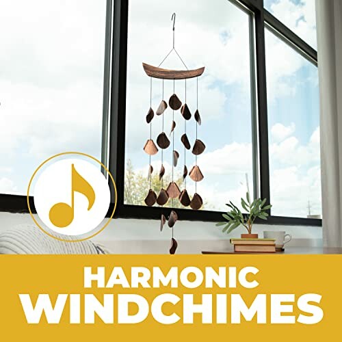 Decorative wind chimes hanging near a window.