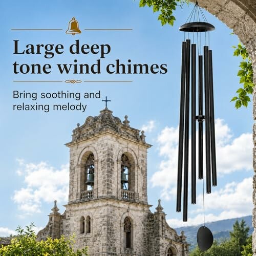 Large deep tone wind chimes near a stone bell tower.