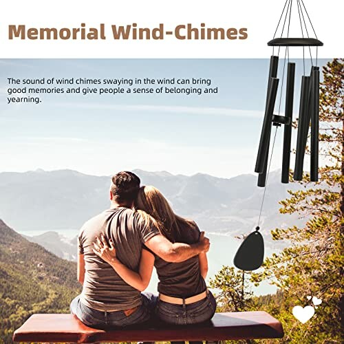 Couple sitting on bench overlooking mountains with wind chimes