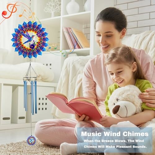 Mother and daughter reading with wind chimes hanging nearby.