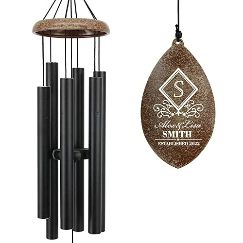 Personalized wind chime with engraved leaf ornament.