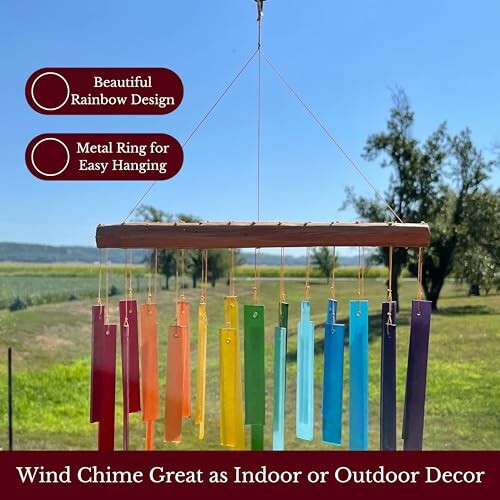 Colorful rainbow wind chime hanging outdoors with a metal ring for easy hanging.