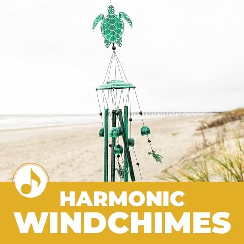 Turtle-themed wind chimes on a beach