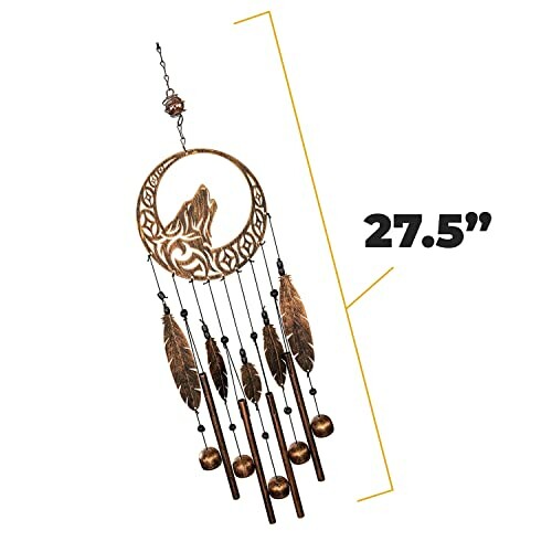 A wolf wind chime with feathers and beads, 27.5 inches long, hanging from a tree branch, swaying gently in the breeze.