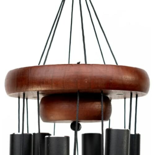 Close-up of a wooden wind chime with black tubes.